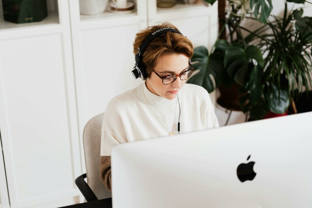 Woman in front of iMac screen