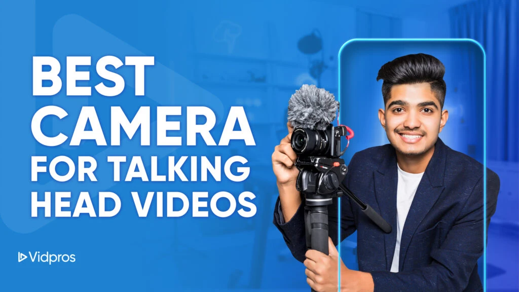 A young man, clad in a dark blazer, holds a camera with a microphone, beaming against a backdrop of blue and white. The text reads: Discover the Best Camera for Talking Head Videos. The Vidpros logo graces the corner, alongside glimpses of lighting equipment.