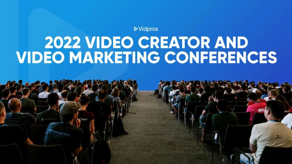 Audience seated in rows facing forward at a conference. The blue backdrop displays the text Vidpros 2022 Video Creator and Video Marketing Conferences, highlighting insights into video editing services that promise to revolutionize content creation with unlimited video potential.