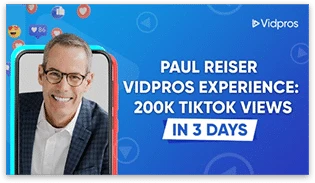 A promotional graphic for Vidpros showcasing a smiling man in a suit on a smartphone screen. Text reads, Paul Reiser Vidpros Experience: 200k TikTok Views in 3 Days, with the blue background dotted by social media and NMO icons.