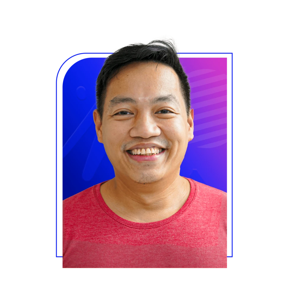 Smiling person wearing a red shirt against a colorful blue and purple gradient background with abstract patterns.
