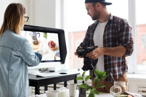 Food-shooting production alt="content creators carefully planning their visual elements for their post in preparation for publication"