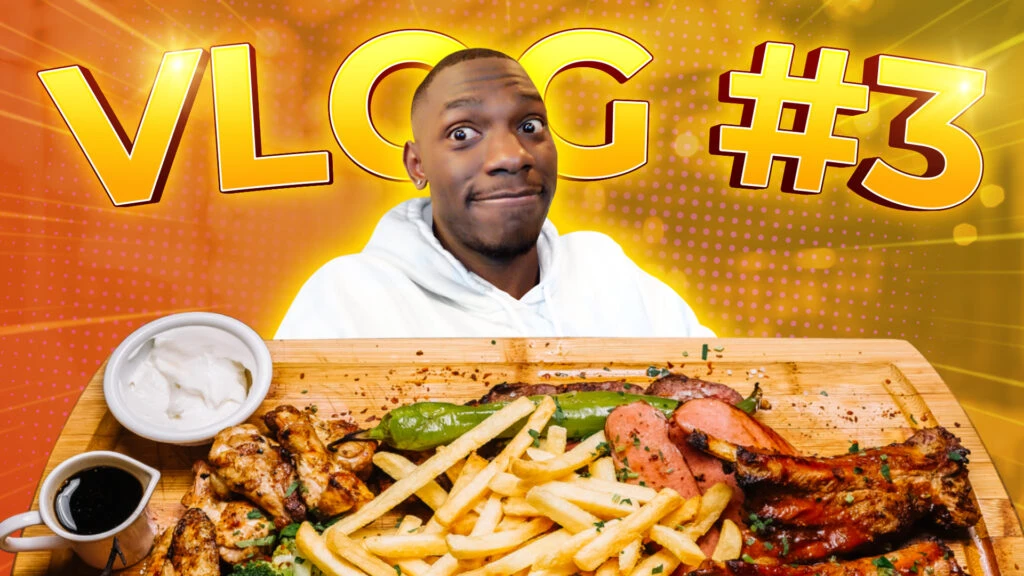 A person in a white hoodie poses with a surprised expression in front of a large wooden platter of food, including fries, sausages, ribs, grilled vegetables, and sauce. The vibrant background serves as an eye-catching YouTube thumbnail with bold yellow text reading VLOG #3 in an orange and yellow design.