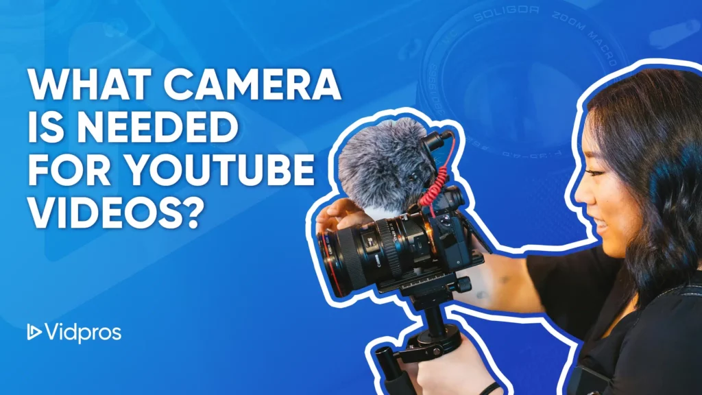 A woman adjusts a video camera with a microphone attached, set against a blue backdrop. The text asks, What Camera Is Needed For YouTube Videos? with the Vidpros logo nestled in the corner.